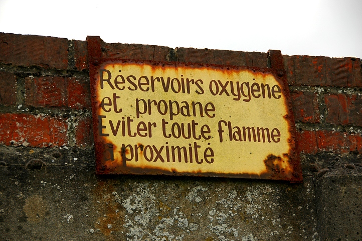 Sign at a wall of a big old steel factory